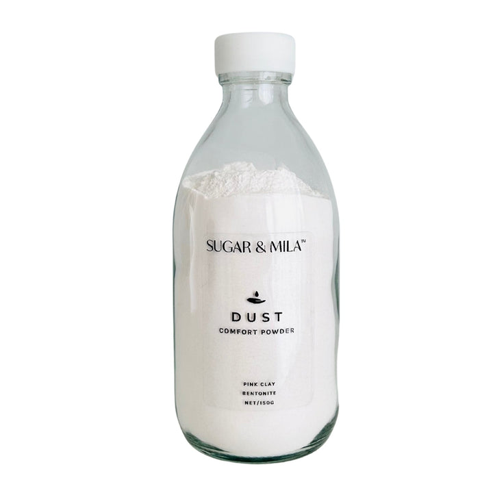 Bottle of Sugar & Mila Dust Comfort Powder on a white background