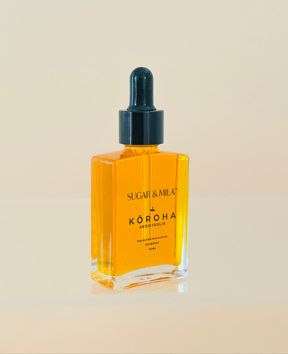 Yellow bottle with black dropper on a beige background