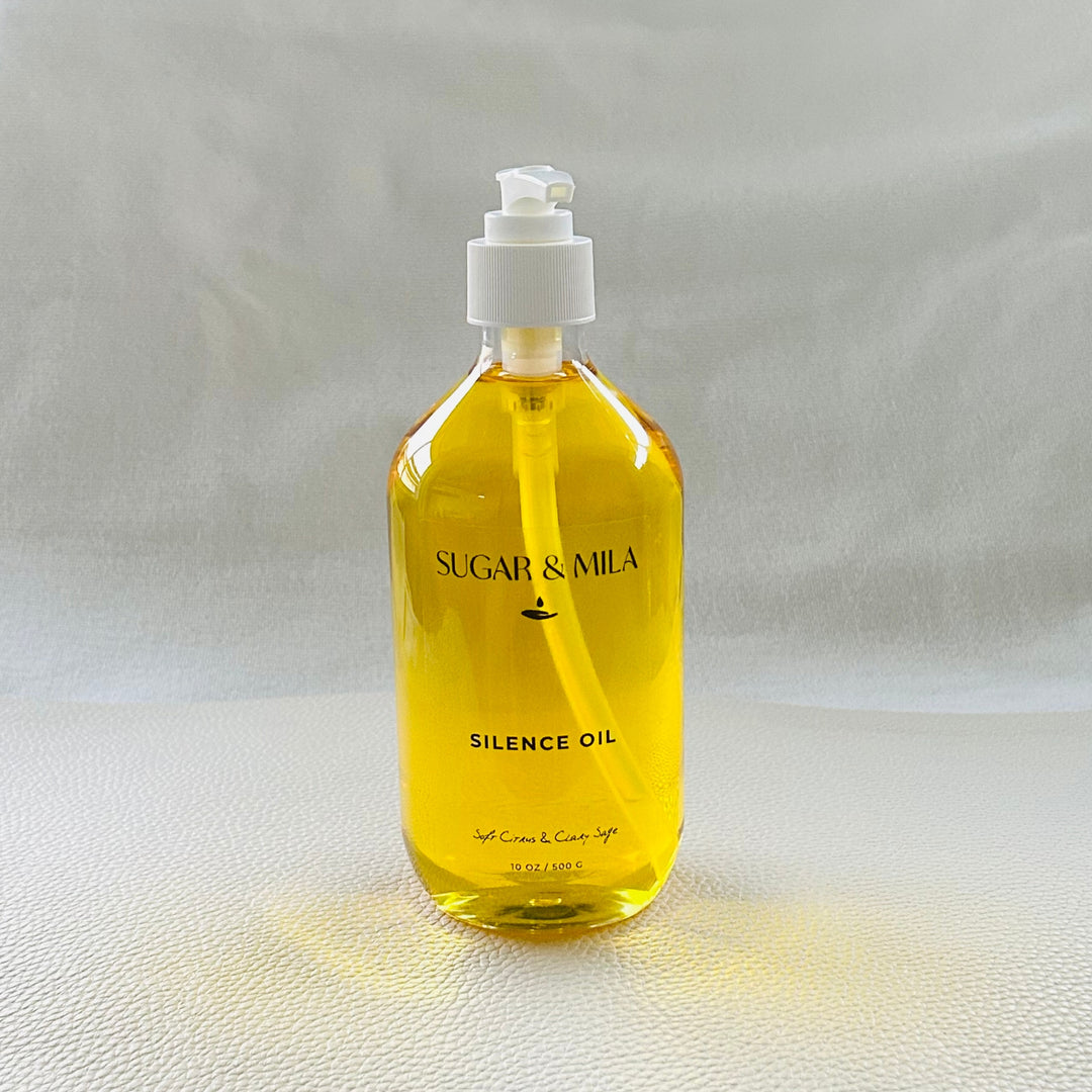 Bottle of 'Silence Oil' by Sugar & Mila on a light gray background