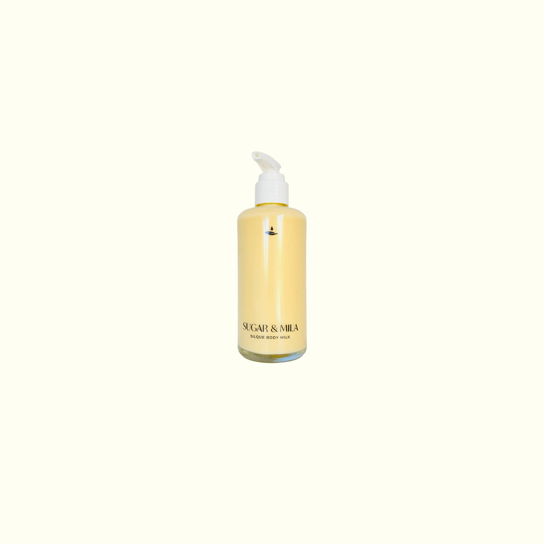 Yellow bottle with pump on a white background