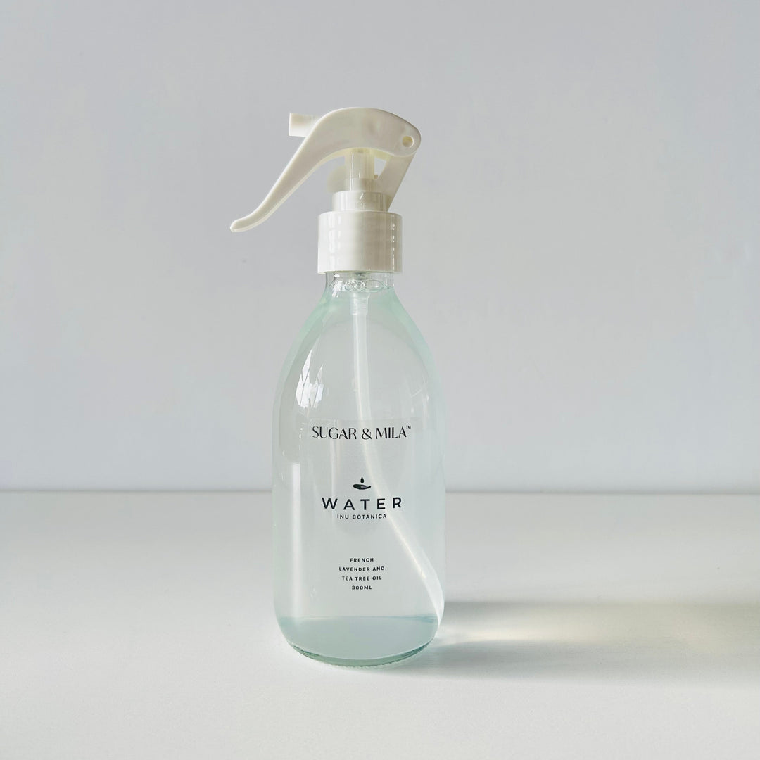 Clear spray bottle labeled 'Sugar & Maple' on a white background