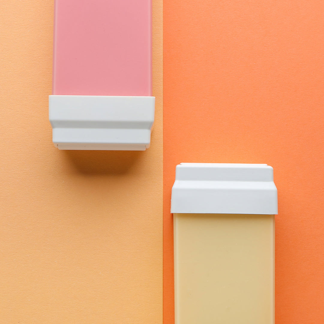 Wax cartridges on colored background