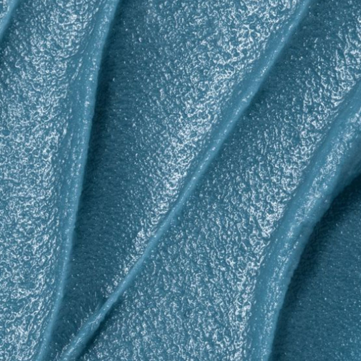 close up textured blue calm balm
